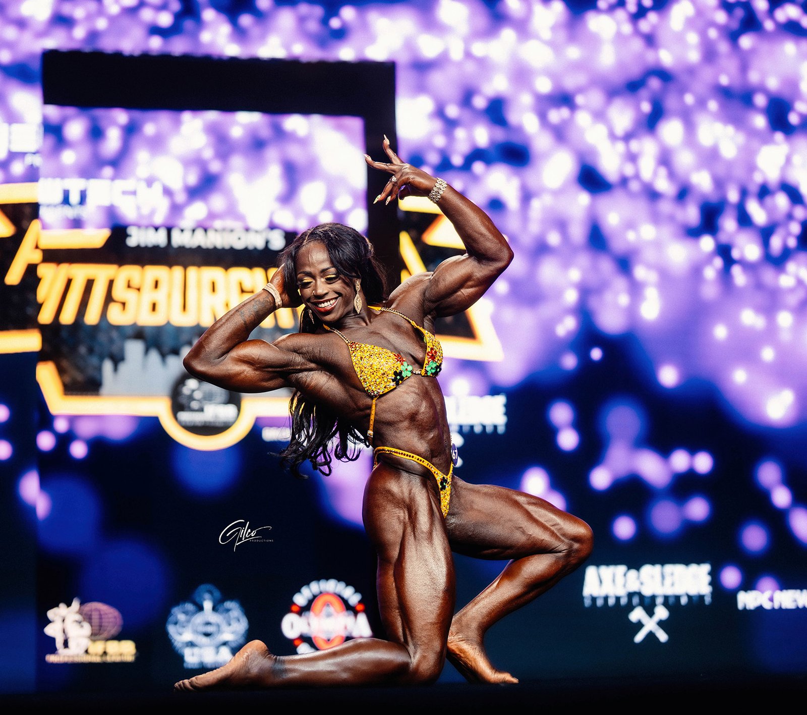 Sheronica Henton posing on stage at the 2025 Pittsburgh Pro in Womens Physique